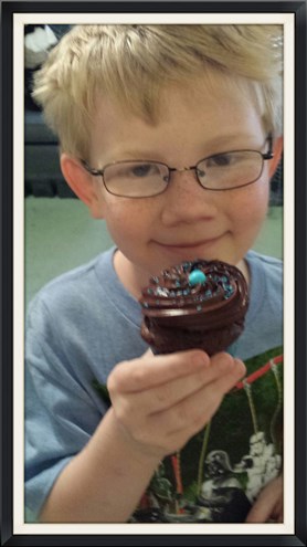 My friend Milo with his 1st House of cookie cupcake